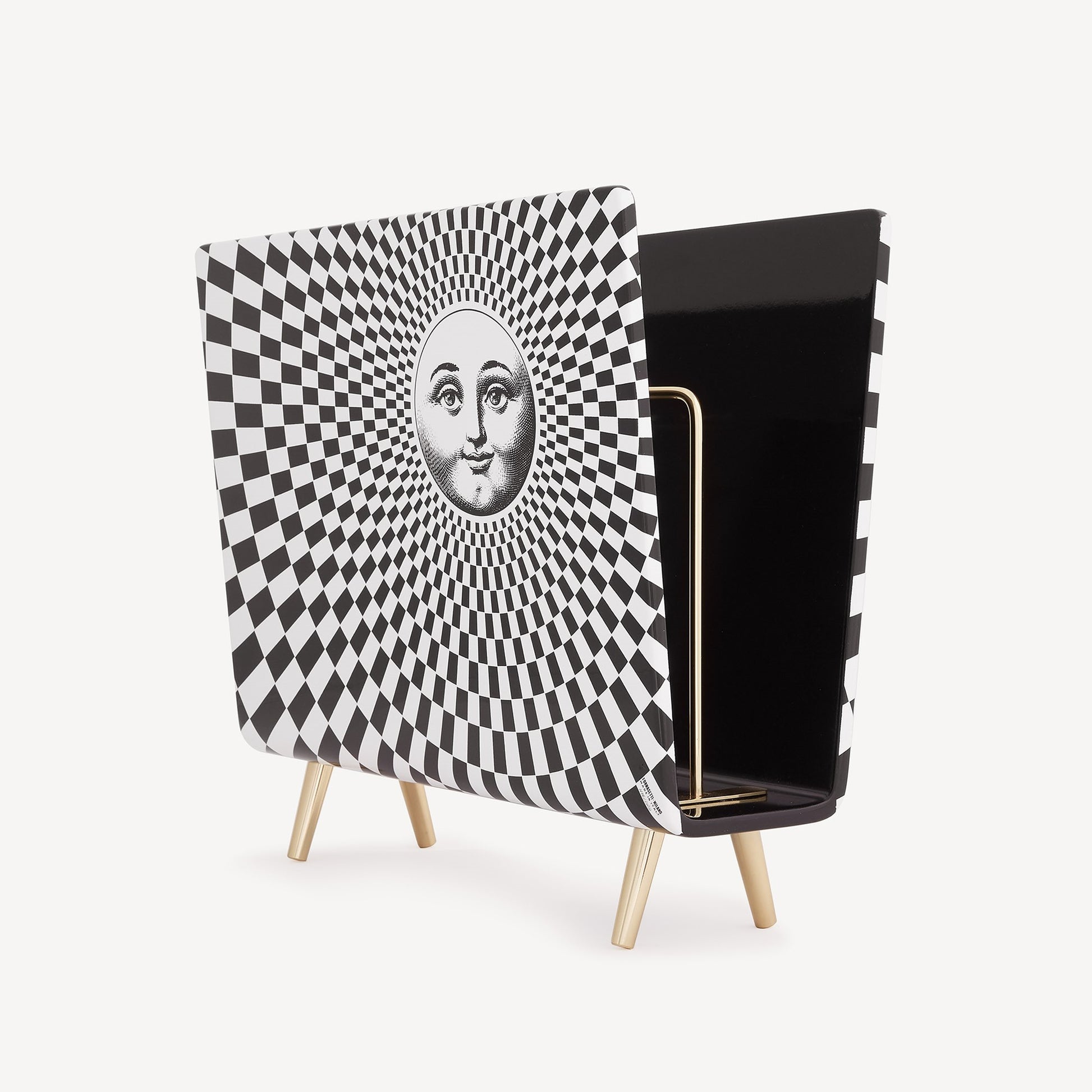 Side view of magazine rack with geometric pattern and gold legs