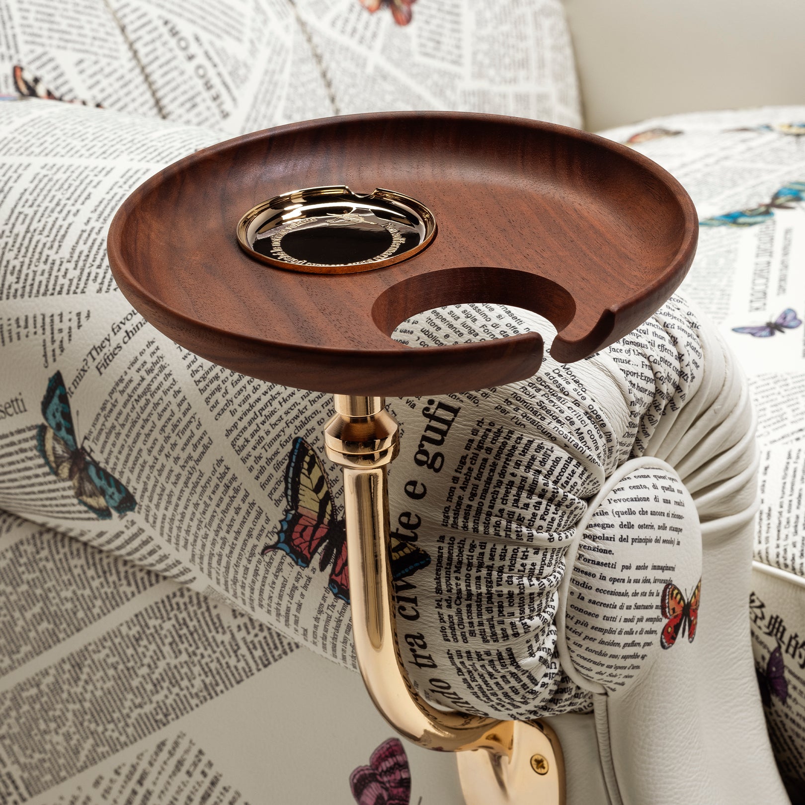 Wooden circular tray with butterfly-print upholstery and gold metal stem