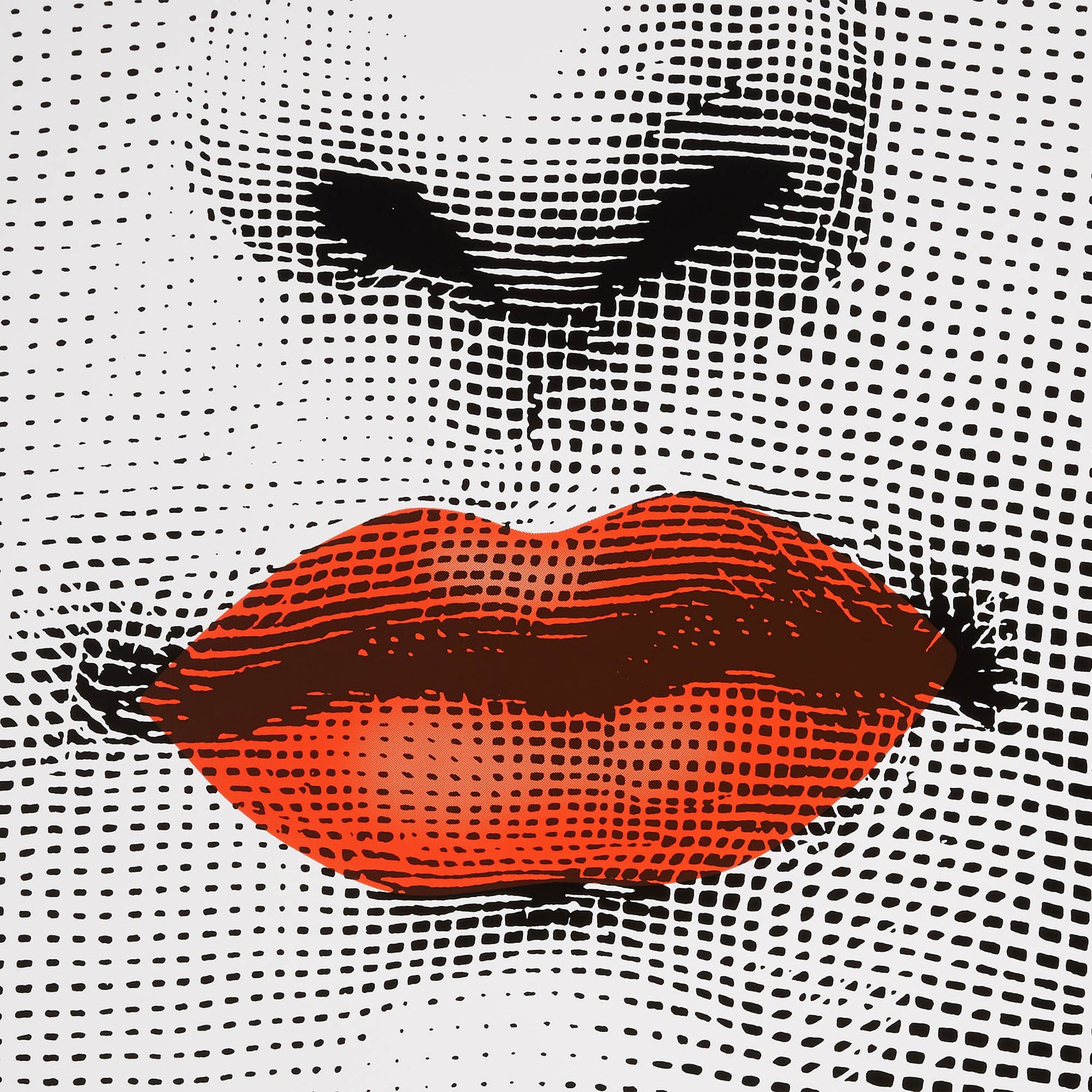 Close-up of lips graphic on perforated table surface