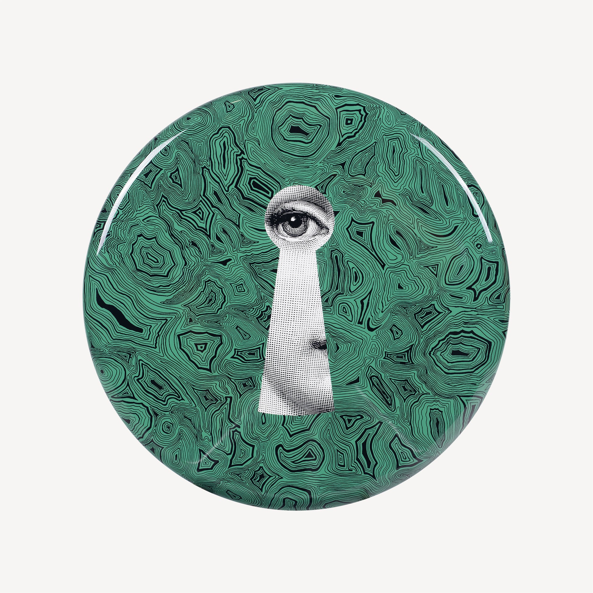 Green patterned round lid with cutout eye and keyhole-like shape