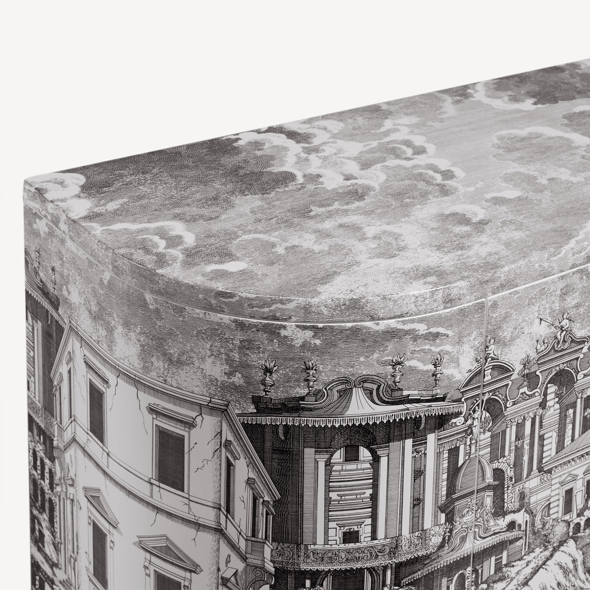 Close-up of curved console with ornate architectural print